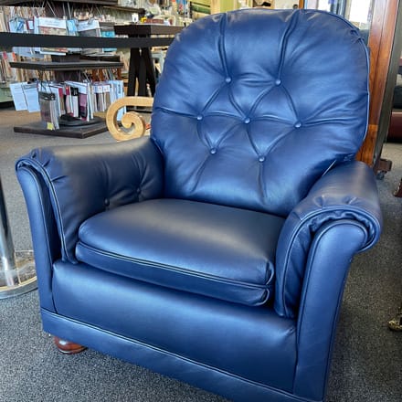 Chair reupholstered with blue letaher, tufted back and arms