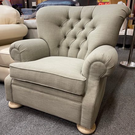 Chair reupholstered with grey fabric and tufted back