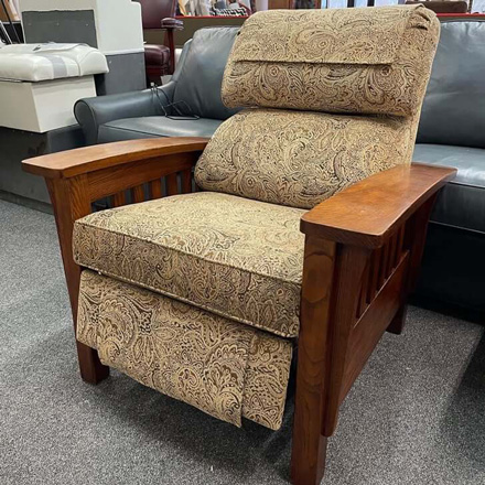Recliner chair with wooden arms reupholstered with contemporary patterned fabric