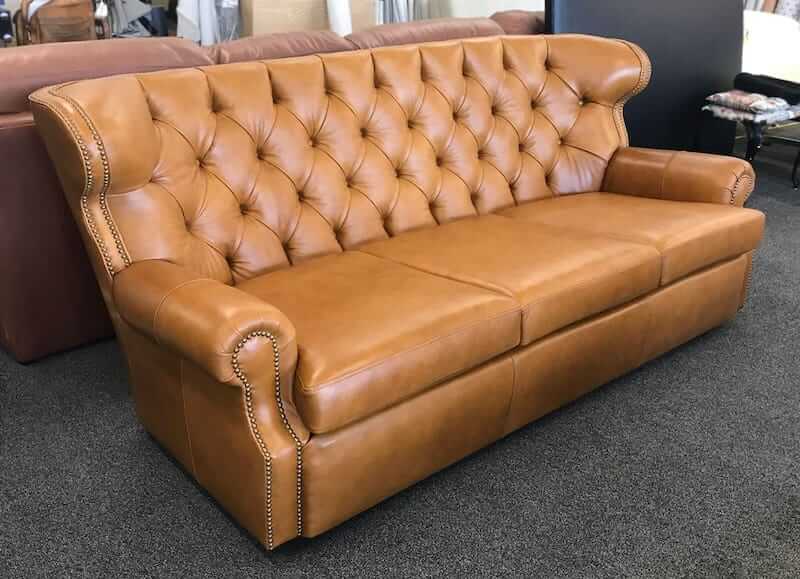 Custom built tufted brown leather chair