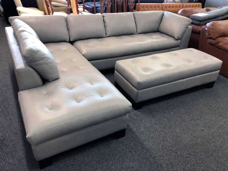 Custom buit grey leather sectional with ottaman